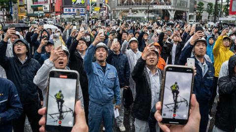 Ads Placed on Power Line Workers' Boot Soles, Monetizing Citizens' 'Will They Fall?' Gaze
